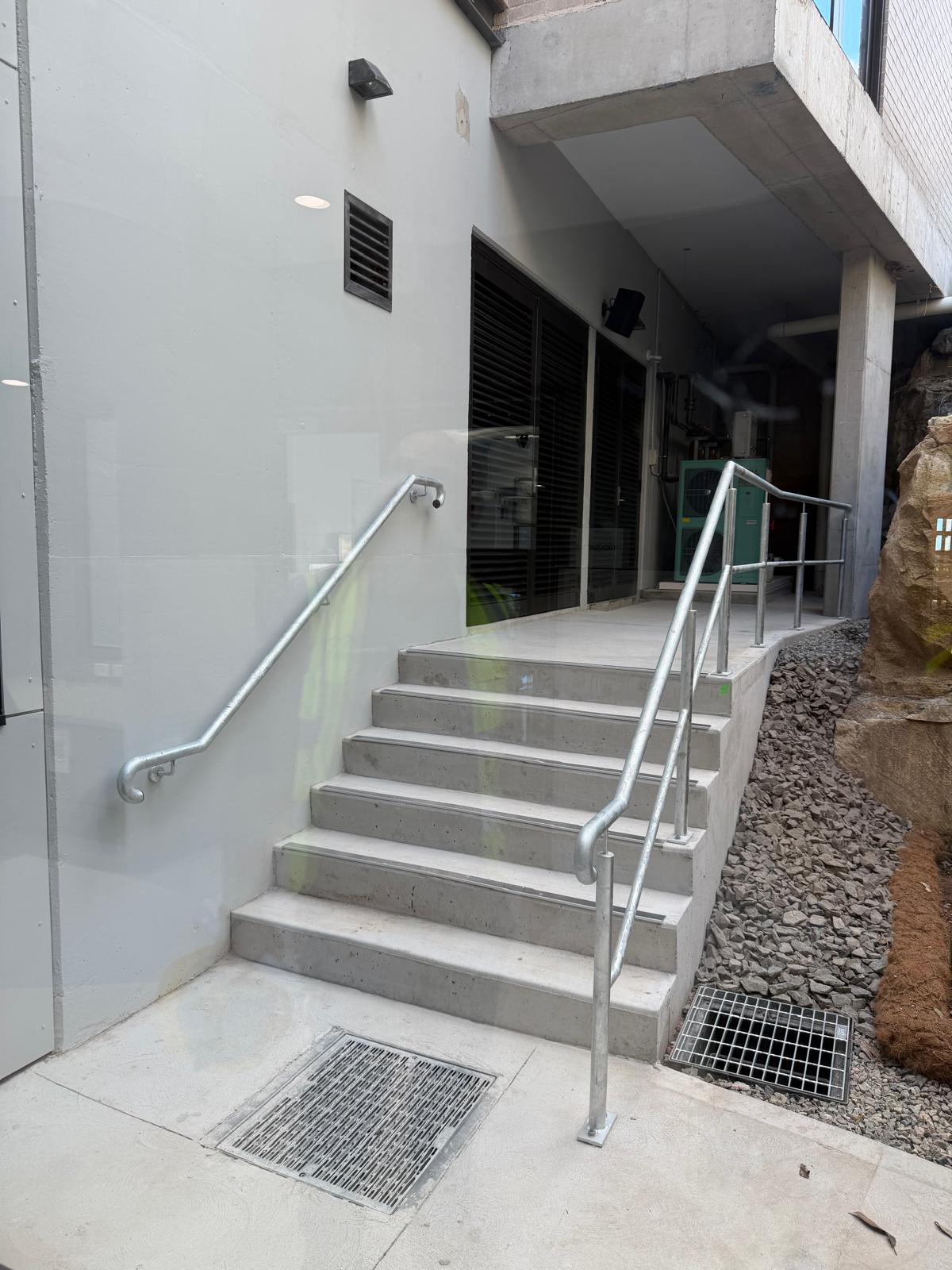 Galvanised handrails beside concrete stairs at Taronga Zoo